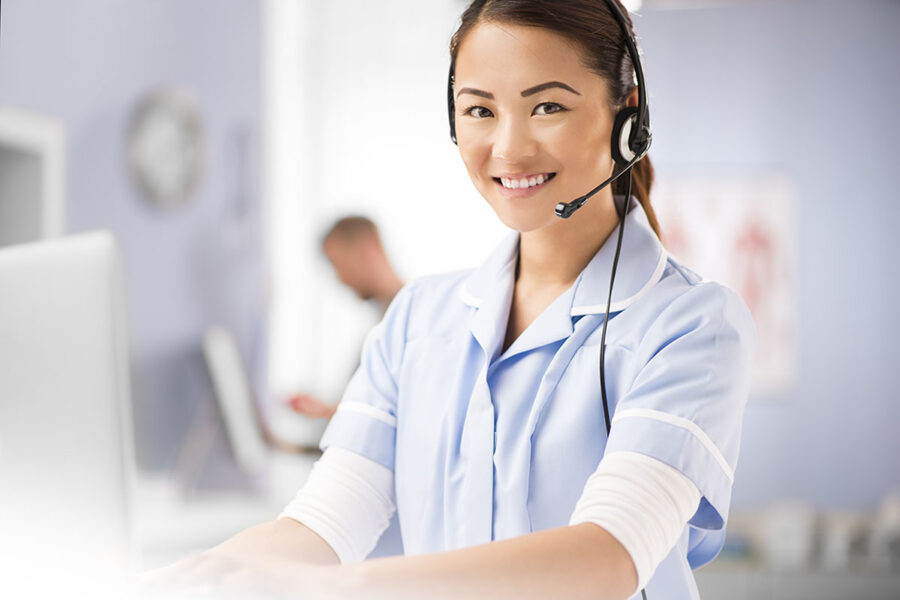 nurse using a remote patient monitoring system